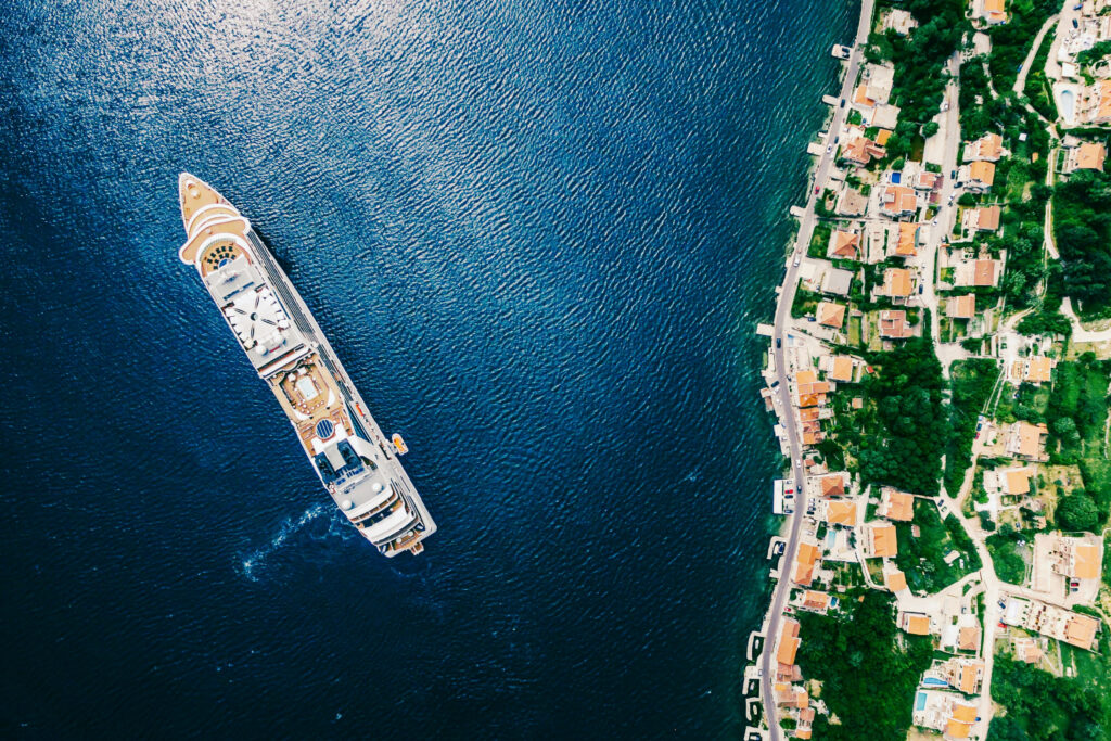 A luxury ship anchored off a coastal village in Montenegro's Bay of Kotor.
